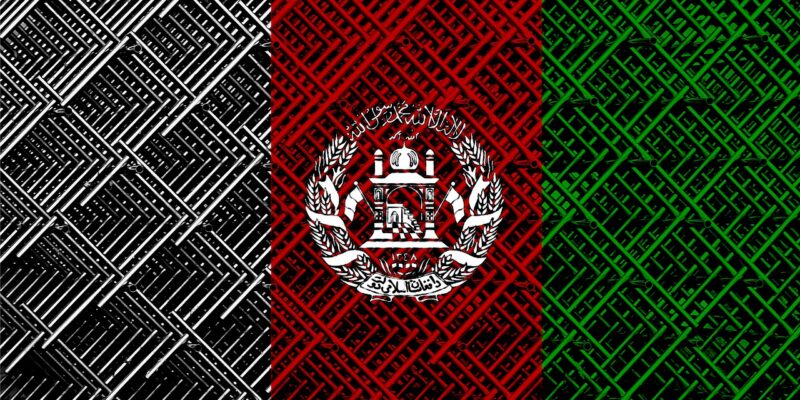 The Afghan flag, rendered as if made of or painted on a chain-link fence.