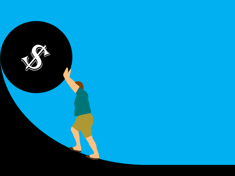A clipart image of a white man pushing a boulder, labelled with a dollar sign, up a stiff slope. The man and boulder face to the left, implying that the boulder will roll back down the slope and crush him.