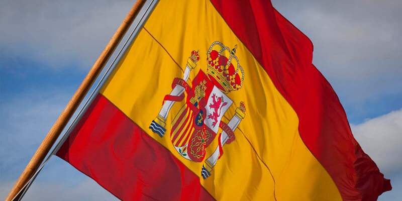 The Spanish flag. It's tilted heavily to the right, as if slumping.