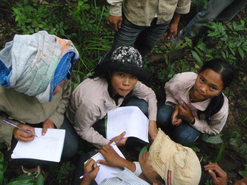Kuy girls with pens and paper, photographed as part of a 2008 USAID mission in Cambodia to organize local communities to protect the Prey Lang.