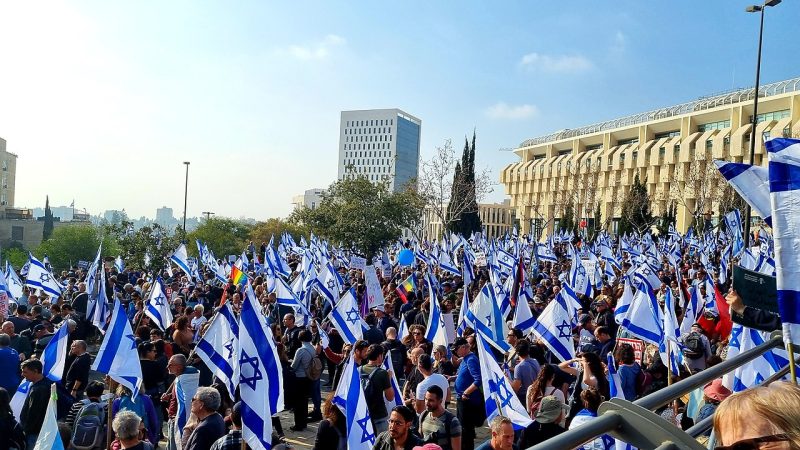 A crowd holding Israeli flags protests judicial reforms in Jerusalem in February.