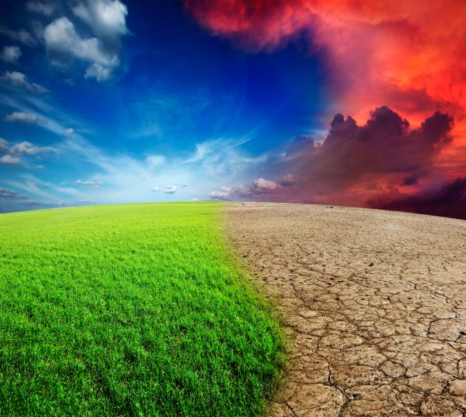 A digital image of a hill. The left side of the hill is covered in green grass, with a sun shining brightly in a blue sky. The right half of the image has dry, cracked earth under a red sky filled with cloudy haze.