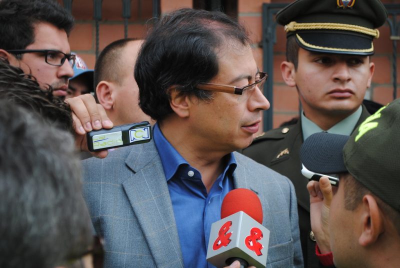Now-President Gustavo Petro, photographed in a crowd of reporters in 2011.
