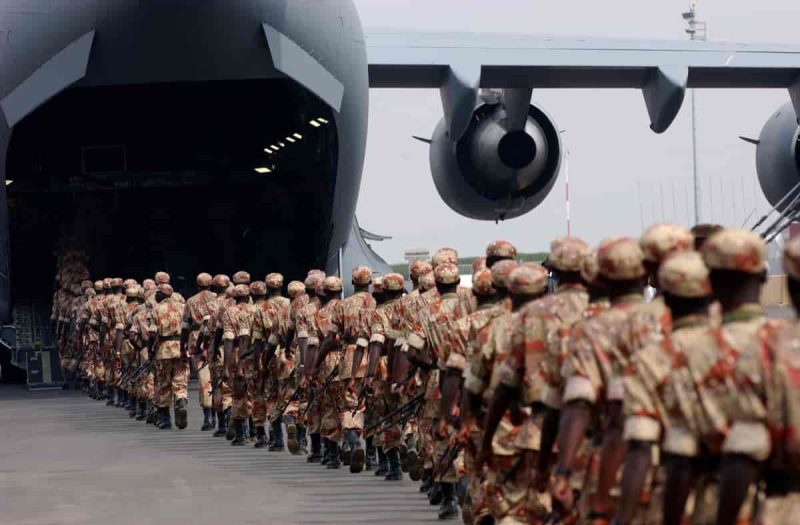 Rwandan soldiers line up to board a U.S. Air Force plane for transport to Darfur. Photo from 2005.