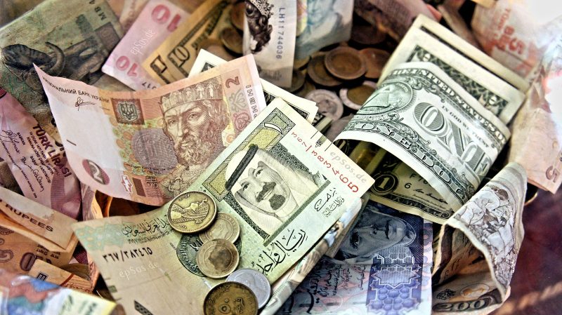 Paper bills and coins in different currencies. Pic: McZusatz via Wikimedia Commons